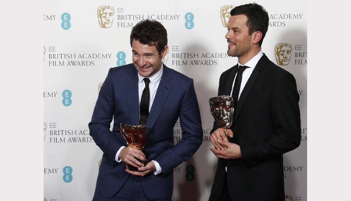 Bart Layton (L) and Dimitri Doganis celebrate after winning the Outstanding Debut by a British Writer, Director or Producer for "The Imposter". Photos: GETTY IMAGES, REUTERS