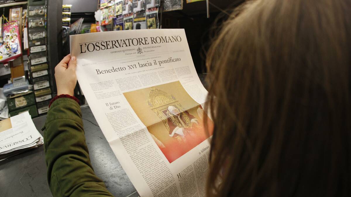 A woman reads the front page of Osservatore Romano newspaper in Rome February 11, 2013. Pope Benedict shocked the world on Monday by saying he no longer had the mental and physical strength to cope with his ministry. Photo: REUTERS
