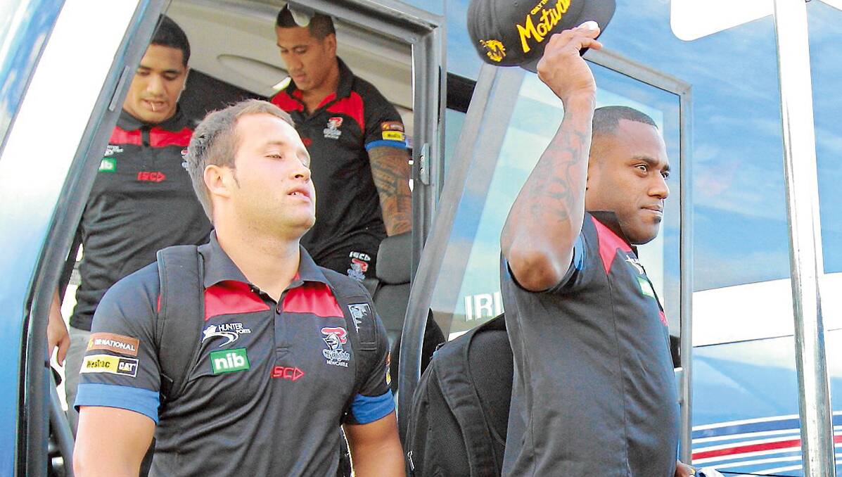 WE’RE HERE: Knights heavy hitters Tyrone Roberts, left, and Aku Uate get off the bus in Tamworth yesterday afternoon ready for an intensive four days of training and community activites before Saturday night’s game against the Cronulla Sharks.