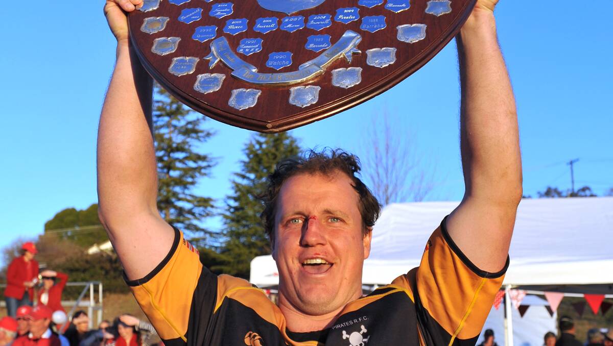 Pirates skipper Bart Leach lifts the Central North first grade premiership shield.  Photo: Barry Smith 150912BSD80