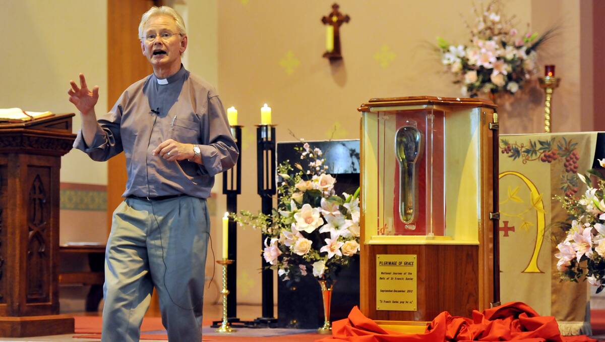 REVERED RELIC: Father Richard Shortall SJ speaking about Francis Xavier, whose 460-year-old forearm visited St Nicholas’ Catholic Church on Sunday and Monday morning. Photo: Barry Smith 181112BSF12