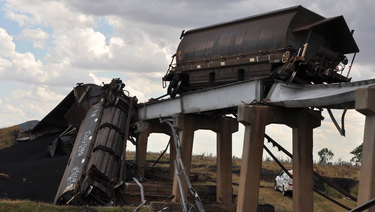 BRIDGE OUT: The driver of a fully-laden coal train escaped injury yesterday when six wagons derailed on the Coxs Creek Bridge near Boggabri. Photo: Keith Millerd/Namoi Valley Independent