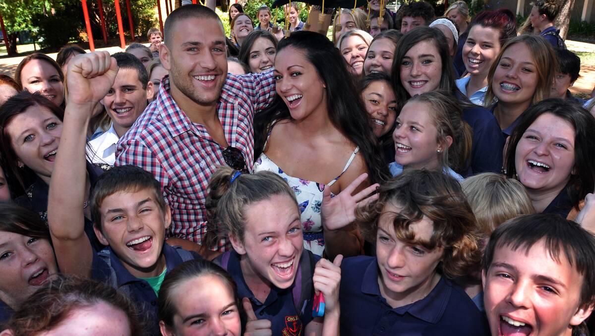 BIG BROTHER contestants Sam Wallace and Layla Subritzky surprised hundreds of secondary school students at Oxley High this morning with an appearance at their final assembly of the year. Photo: Geoff O'Neill