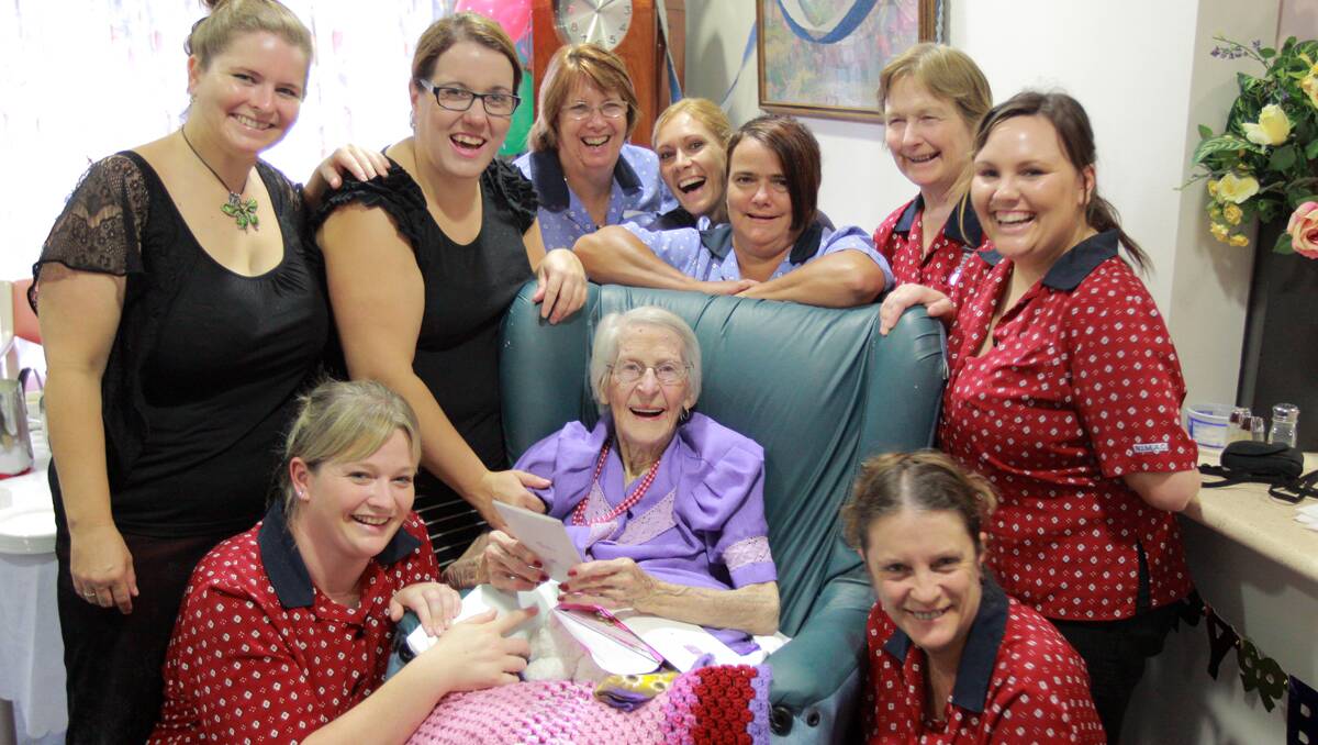 LONGEVITY IN THE FAMILY: Moonby House staff members, Steph Wood, front left, and Lynda Amidy, front right,  join Esma O’Toole and her family and friends for Mrs O’Toole’s 102nd birthday bash. At back is Adi Goff, Sophie Bailey, Donna Cochrane, Rosie Price, Anna Langbein, Philomena Graham and Chantell Johnston.  Photo: Robert Chappel 010213RCA18