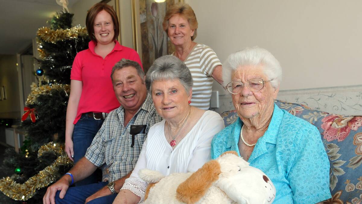 CELEBRATION: 101-year-old Edith Jeffries, right, with, from back, granddaughter Fran Hewlett, daughter-in-law Irene Jeffries, son Arthur Jeffries, and daughter Dawn Quick. Photo: Geoff O’Neill 181212GOC02