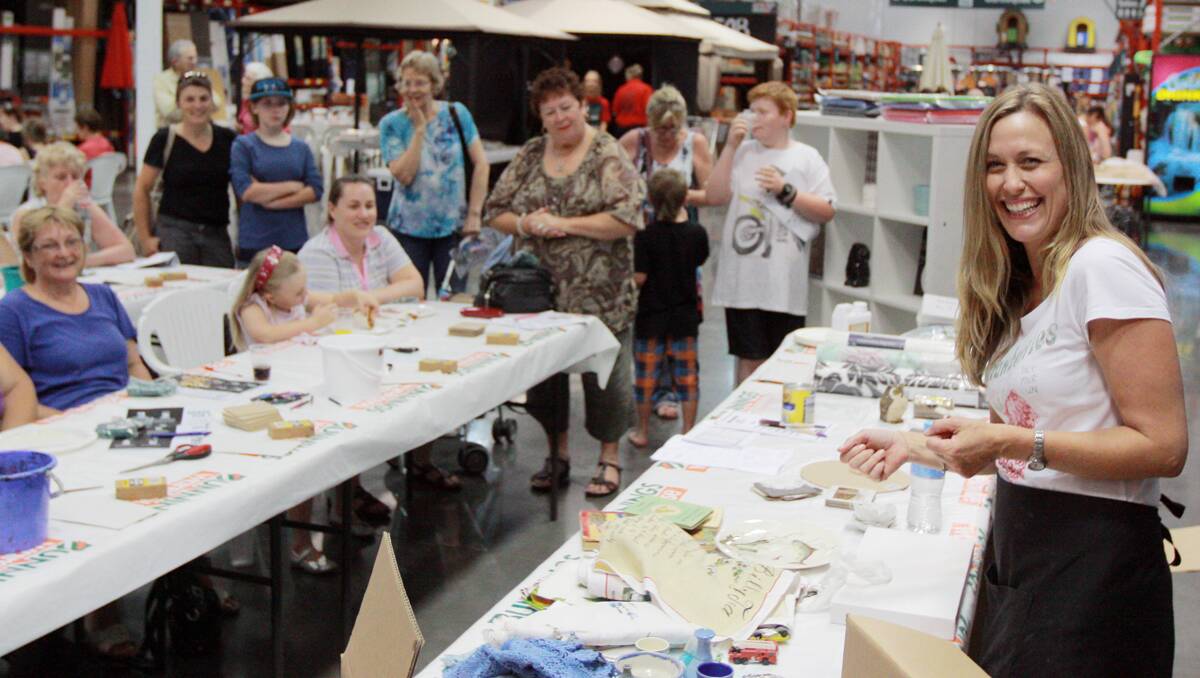 STAR POWER: Tara Dennis, of Better Homes and Gardens, right, held a do-it-yourself demonstration evening for women last Thursday at the Tamworth Bunnings Warehouse. Photo: Robert Chappel 220213RCA01