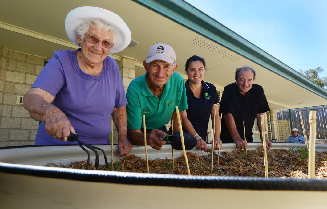 GREEN THUMBS: From left, Peel River Gardens resident Shirley Christian, John Tucker from Landcare, village manager Christina Shafik and resident Clive Chambers. Photo: Barry Smith 211113BSD02
