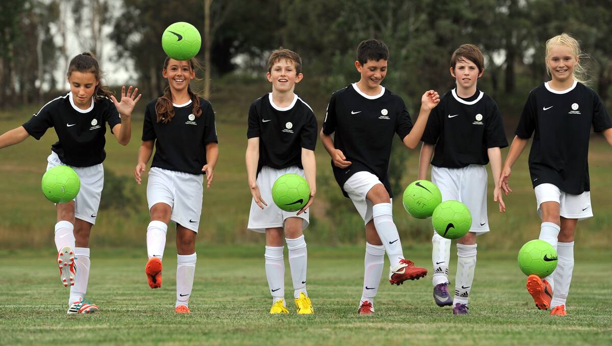 Kicking out at the NNSW Football camp in Armidale were (from left) Phoebe Cave (Tamworth), Maddy Sharp (Quirindi), Jack Campbell (Armidale) Reese Habchi (Uralla), Hunter Hine (Armidale) and Izzy Winter (Armidale).   Photo: Barry Smith 140113BSD06