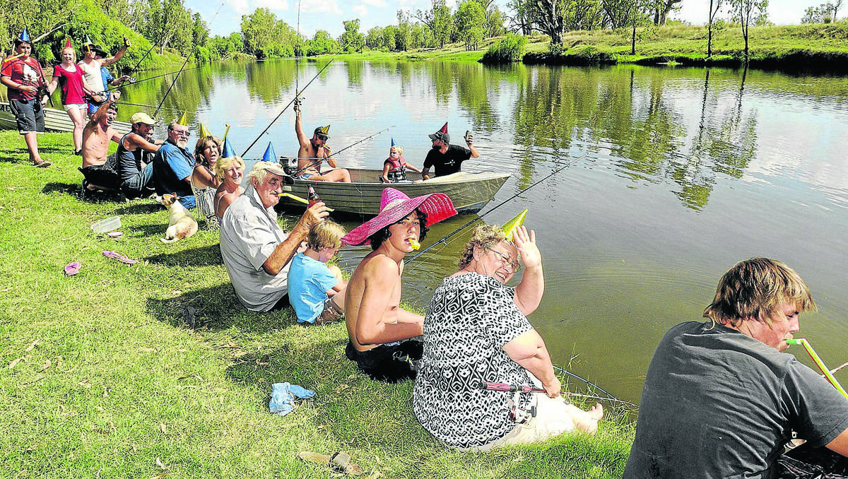CELEBRATION: Where better to spend New Year’s ever than on the banks of the Namoi River near Carroll. The Mills family and friends enjoy the serenity. Photo: Peter Lorimer