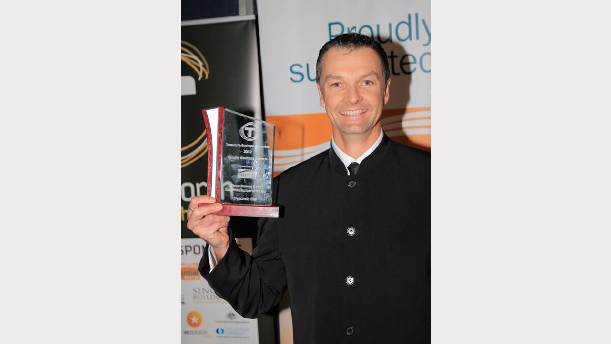 Wayne Koppel from Dynamic Fire, holds his award for Defence Reserves Support at the Quality Business Awards held at TRECC on Friday night. Photo: Robert Chappel