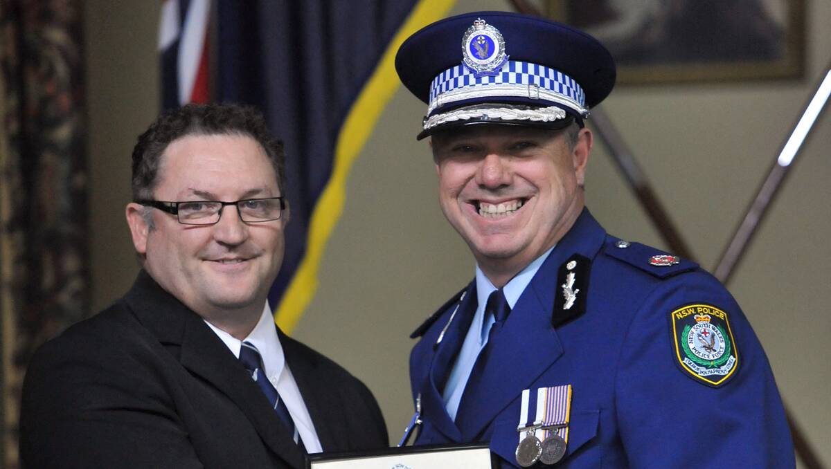 CITATIONS: Detective Senior Constable Michael Maloney was awarded three commendations at the Oxley LAC awards ceremony at Tamworth Town Hall yesterday. He is pictured with Western Region Commander, Assistant Commisioner Geoff McKechnie. Photo: Barry Smith 281112BSC33