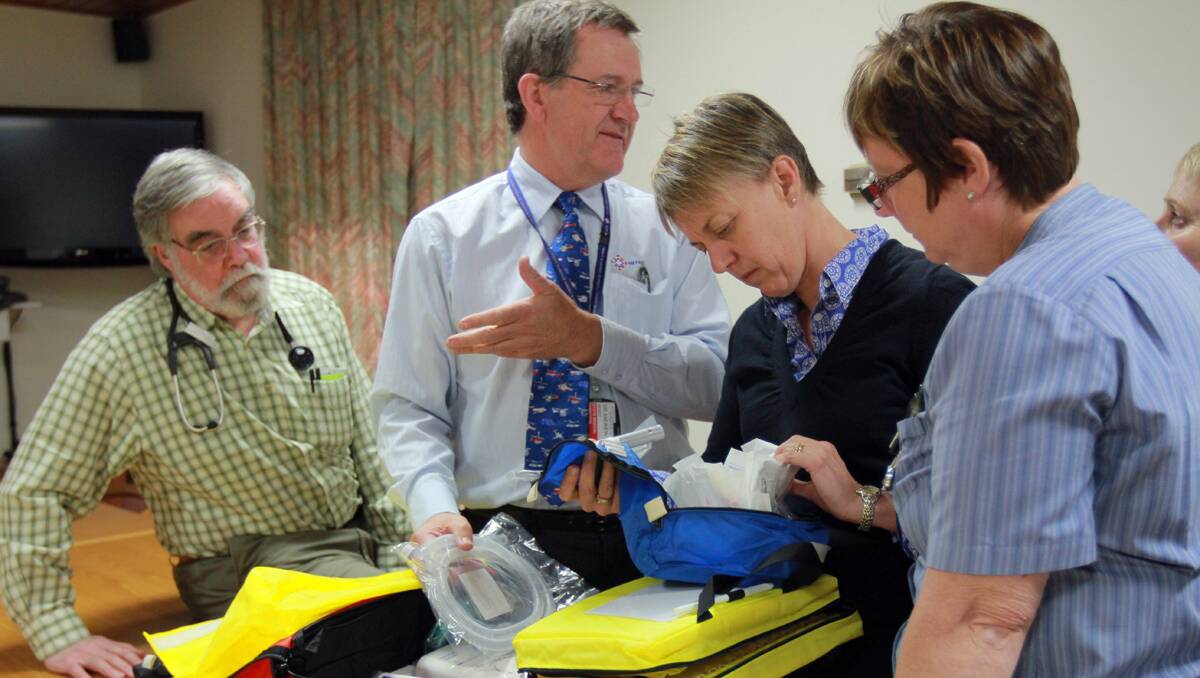 LIFE-SAVING: Inspecting the new equipment are, from left, paeditrician Dr David McDonald, Dr Andrew Berry from the Newborn and Paediatric Emergency Transport Service, paeditrician Dr Helen Goodwin and Tamworth hospital maternity ward nursing unit manager Maureen Dawson. 121012RCB05