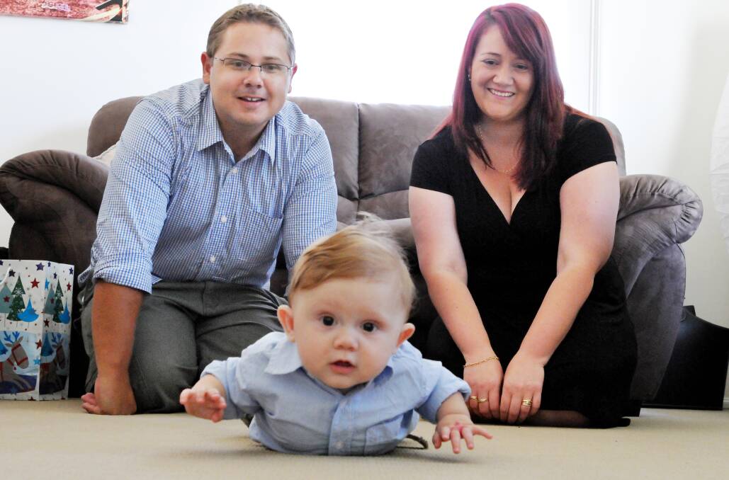 POPULAR CHOICE: Proud parents Shannon and Ashleigh Tolmie with six-month-old son Lachlan. Lachlan has emerged as Tamworth’s most popular baby boy’s name for 2013. Photo: Daniel Johns 010114DJ01