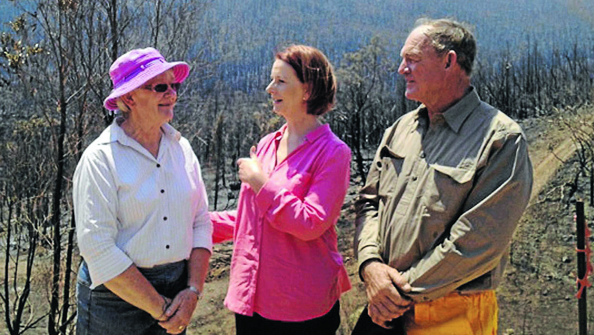 sympathetic ear: Prime minister Julia Gillard with Bob and Jeanette Fenwick who lost their property in the Coonabarabran fire. Photo: Fairfax