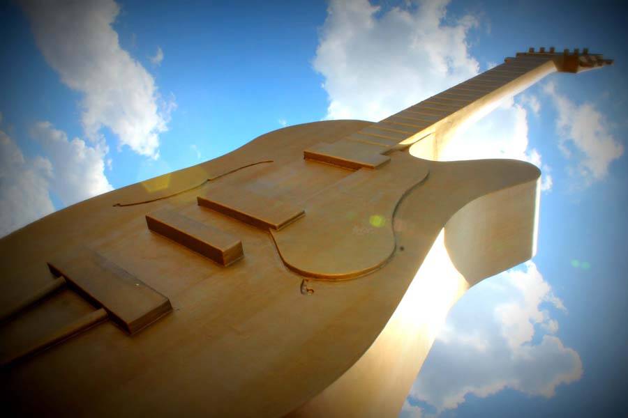 The giant Golden Guitar stretches into the sky, a popular sight for tourists. Photo: Lou Tait