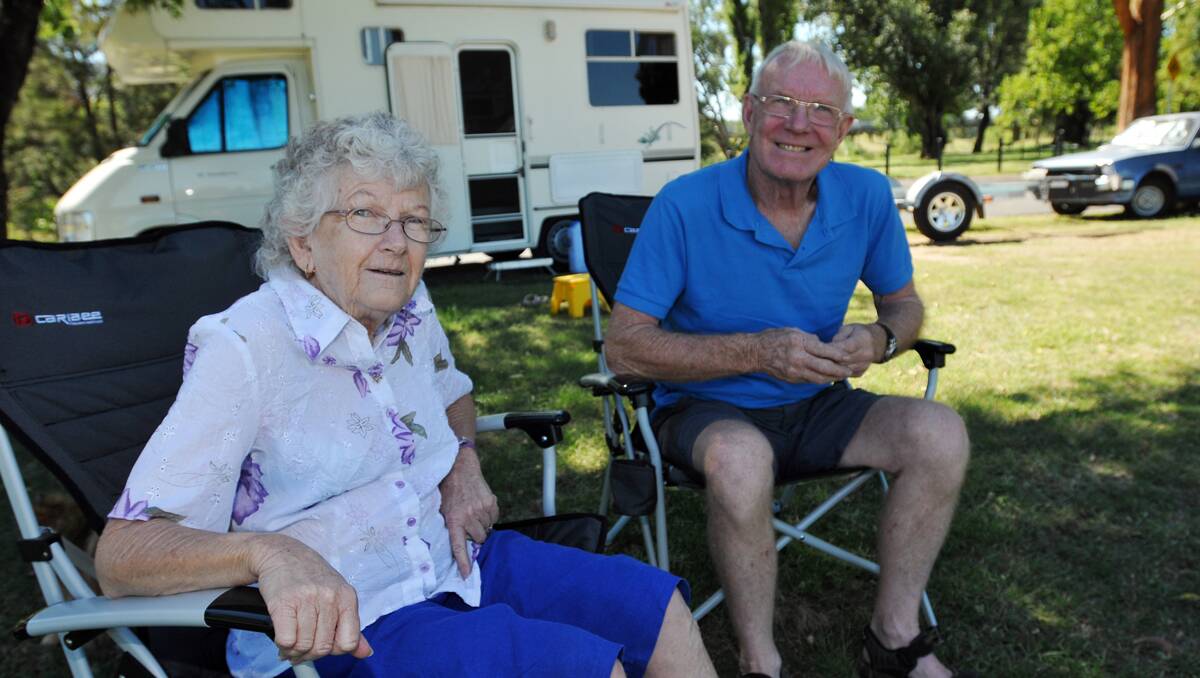 ATMOSPHERE: Gloria and Malcolm Leo at their annual camping spot at the Riverside sporting fields. Photo: Geoff O’Neill 060113GOA01