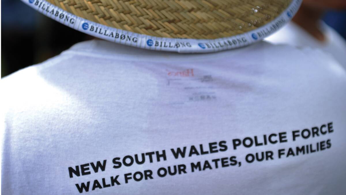 Our Mates, Our Families - the shirt on the back of a walker says it all. Photo: Marina Neil
