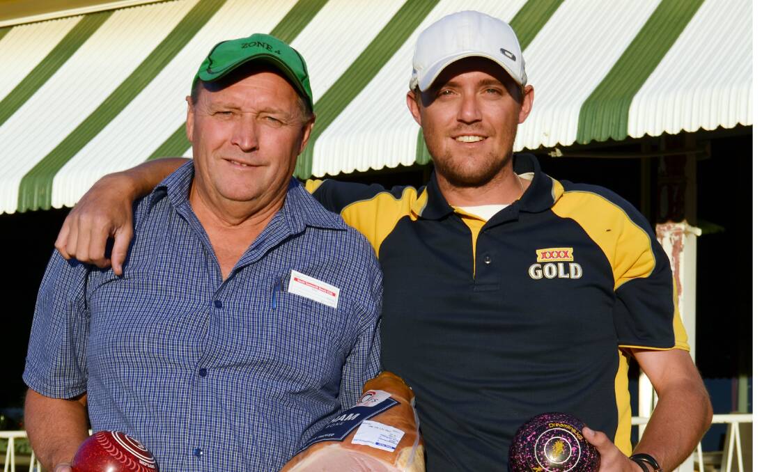 North Tamworth Bowling Club vice president  Dick Russell with son Luke were having a roll on Saturday at the Ham and Bowls night.  Photo: Chris Bath 301113CBA01