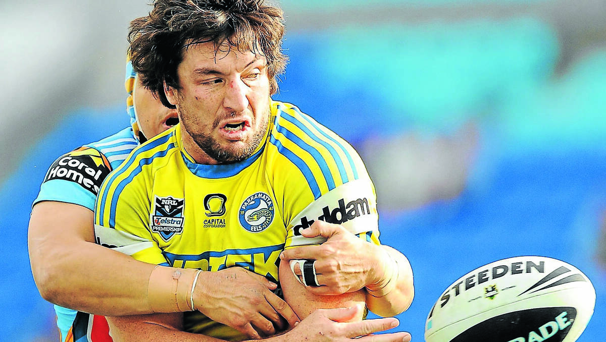 Nathan Hindmarsh unloads against the Gold Coast Titans in August. Photo: Matt Roberts/Getty Images