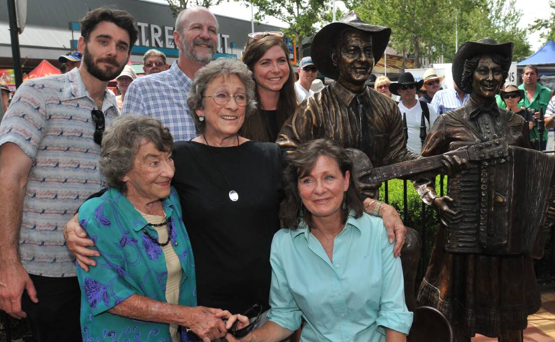 DONE THEM PROUD: James Arneman, David  Kirkpatrick, Kate  Arneman, Heather and Joy McKean and Anne Kirkpatrick at the  historic unveiling  of the Slim Dusty and Joy McKean bronze statue yesterday.  Photo: Geoff O’Neill 240114GOE21