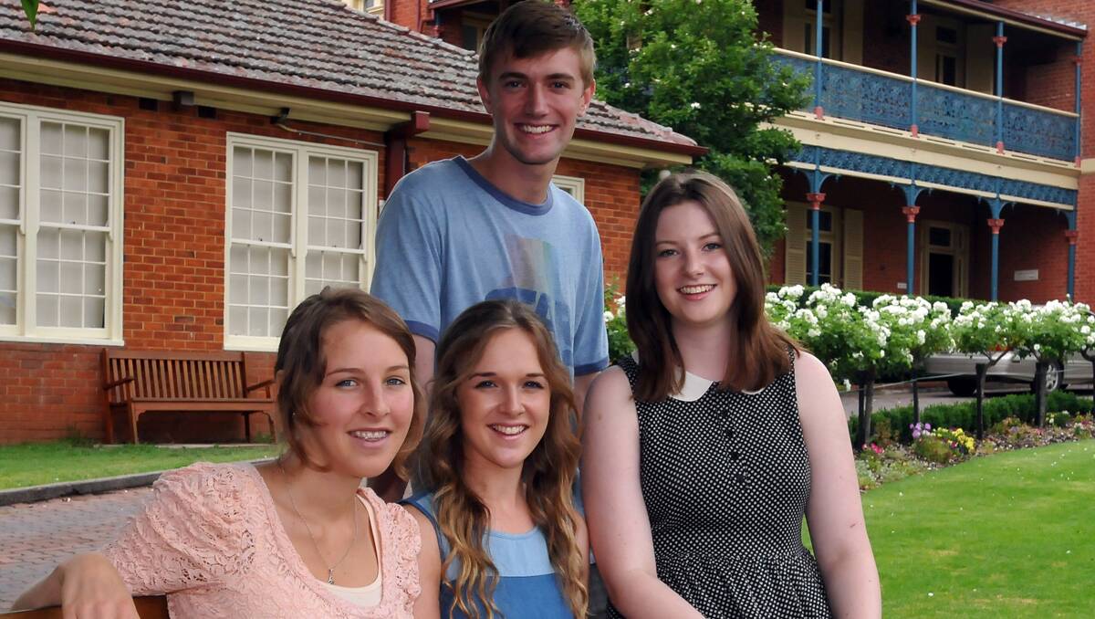 WEIGHT OFF: Calrossy Anglican School students, front, Jean Littlewood (96.65), Lily Barnett (90.6), Catherine McCullough (94.95), and at back Sam Chiswell (96.2), are pleased the suspenseful wait for their ATARs is over. Photos: Geoff O’Neill 201212GOC02