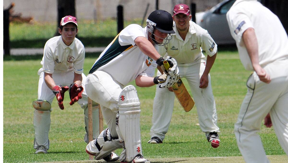 Bective skipper Nick Pearson plays forward during his fateful knee popping innings against West Tamworth in the final first grade round of 2012. He's hoping to be right to lead the Emus again as well as Central North at the Country Colts Championships. Surrounding Pearson are West bowler Deklan Baker, wicketkeeper Campbell Baker and first slipper Shaun Stevenson. Photo: Geoff O'Neill 221212GOC04