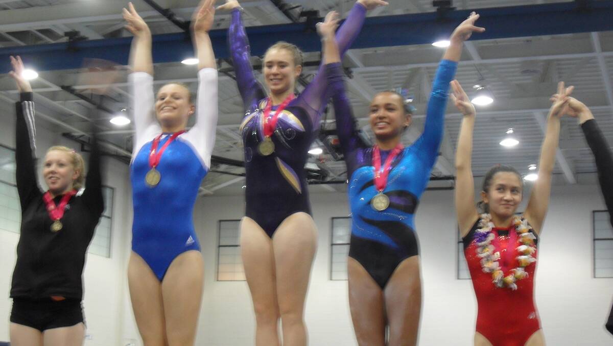 Philippa Tockuss (centre) receives her vaulting gold medal at the Aloha Gymfest in Hawaii.