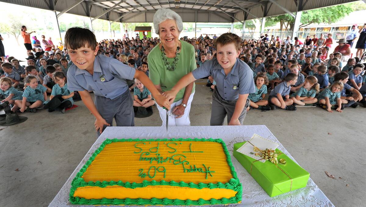 PARTY TIME: Tamworth South Public School vice-captain Bradley Mills, left, former teacher Marlene Ford and captain Joshua McCulloch cut the 60th-anniversary cake. Photo: Barry Smith 281112BSD02