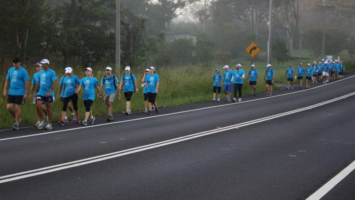 LONG WALK: The 24 participants walking from Tuggerah Lakes to Tamworth between now and March 2 on the road between Swansea and Newcastle yesterday. 