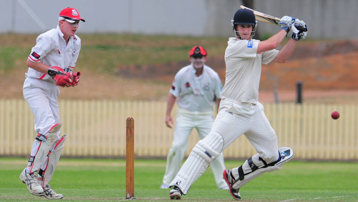 Tim Kensell hammers this delivery off the back foot through cover point on his way to an unbeaten century against North  Tamworth on Saturday. North wicketkeeper Jack Cameron can only look on. Photo: Barry Smith 101112BSB21