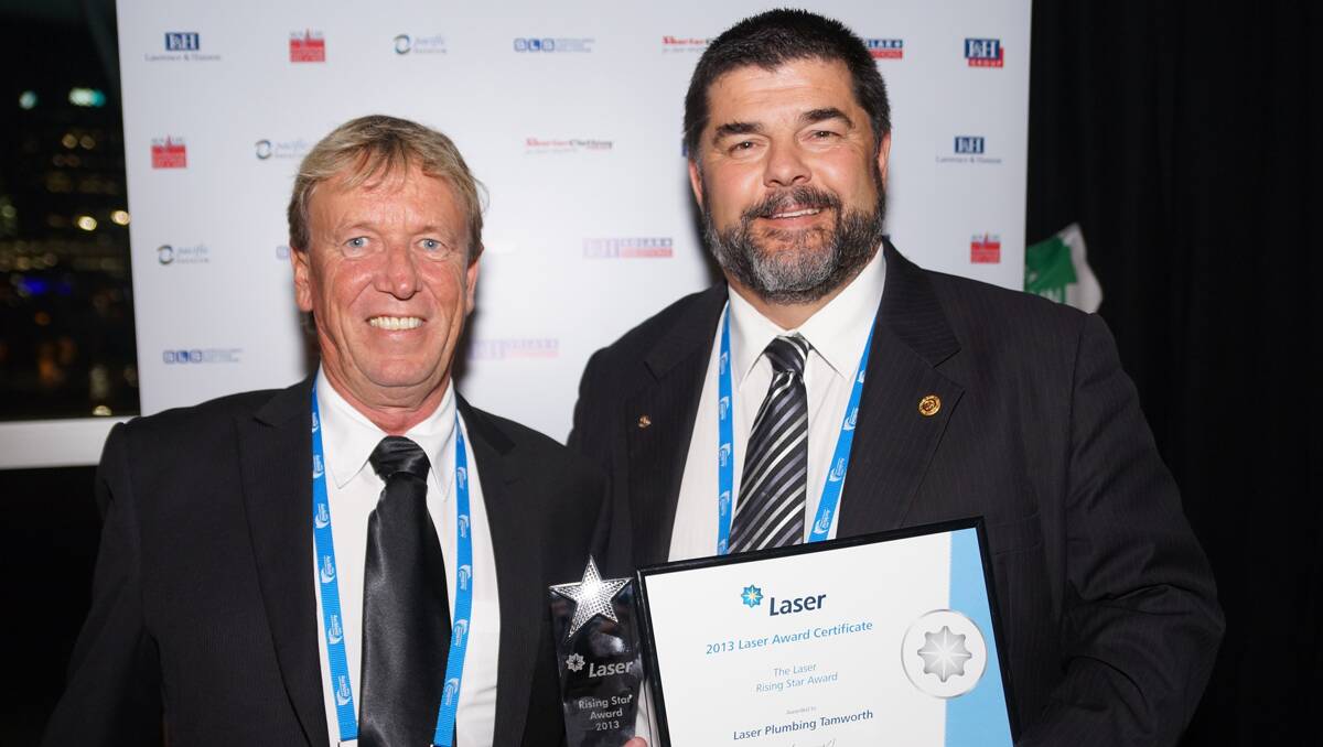 STAR SMILES: Tamworth Laser estimator Ross Smith, left, with business boss Peter Dillon at the group awards ceremony in New Zealand.