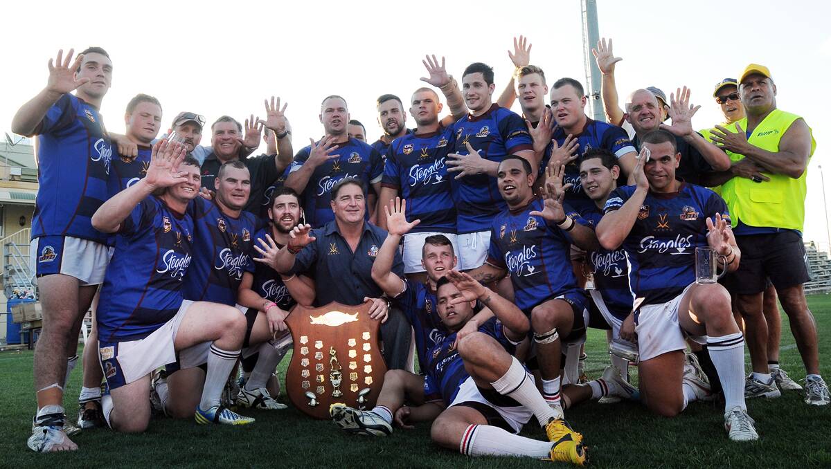 High fives as West Lions celebrate a record fifth successive Group 4  premiership.  Photo: Gareth Gardner  080913GGD37