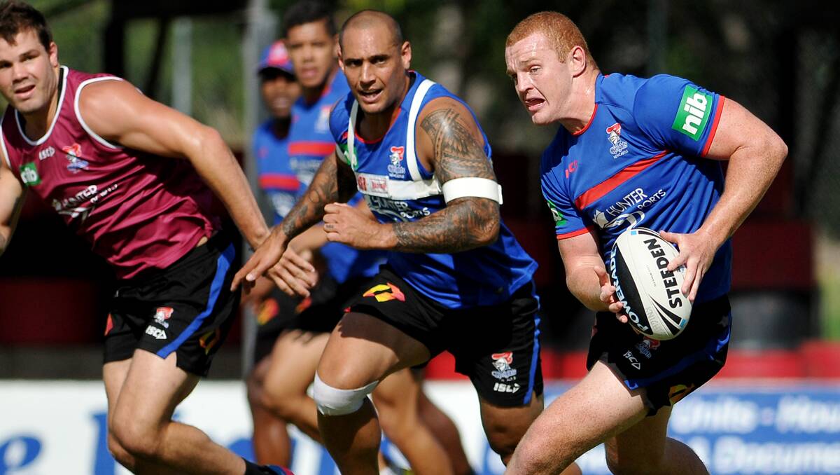 Alex McKinnon runs the ball at Knights training in Tamworth last week ahead of the trial game against the Sharks.  Photo: Grant Robertson 210213GRA17