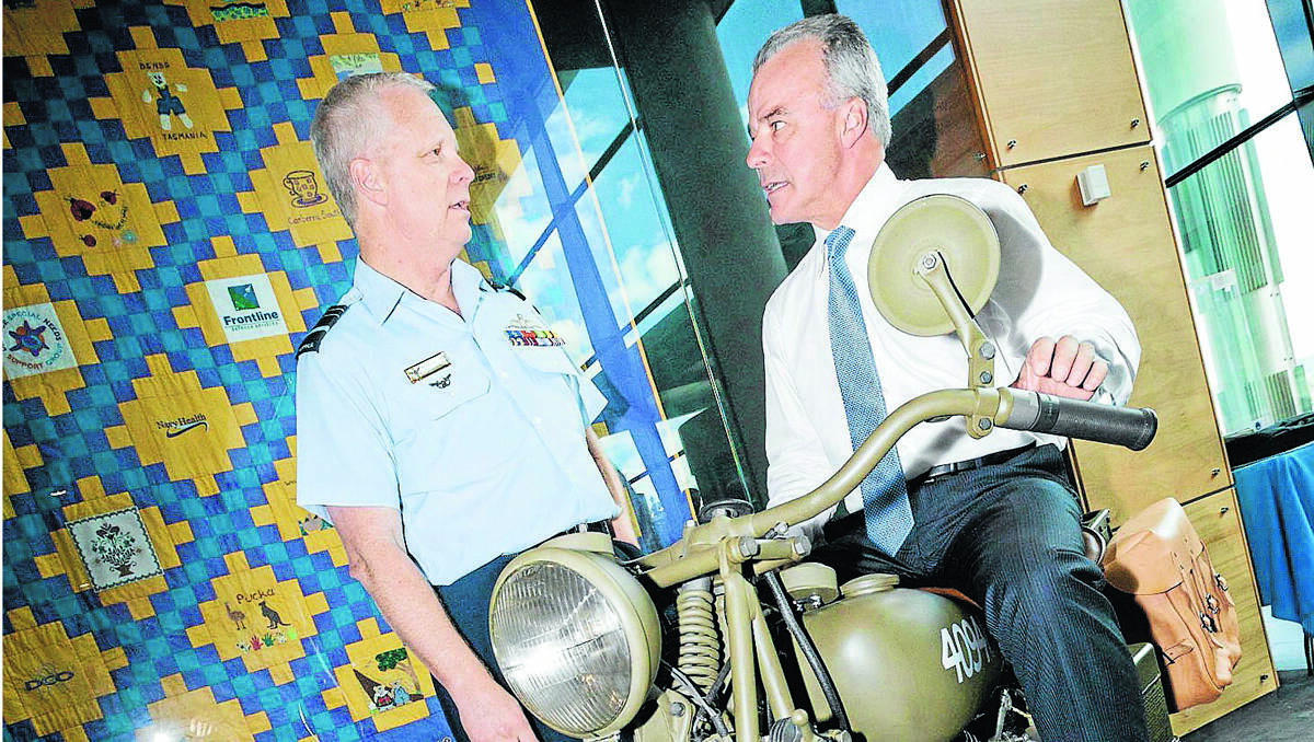 EPIC JOURNEY: Air Marshal Mark Binskin, left, promoting the Long Ride with director of the Australian War Memorial, Brendan Nelson, who’s sitting on a WWII era Indian motorcycle on loan from the war memorial. Photo: Fairfax