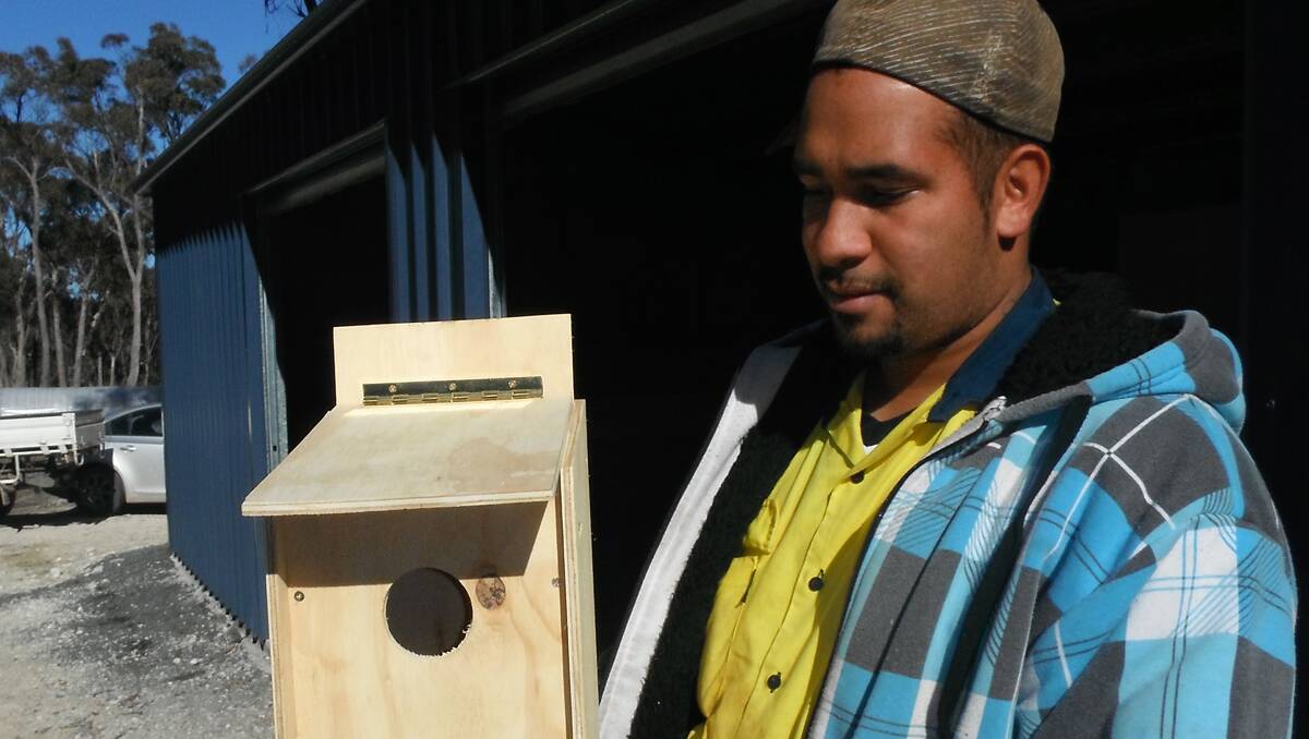 LEARNING EXPERIENCES: Tremane Patterson with a bird box manufactured by Aboriginal staff on Tarriwa Kurrukun.