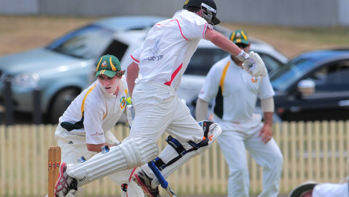 Bective-East keeper Matt Everett is about to rattle the stumps as North skipper Michael Rixon hurdles his way home in a recent first grade clash. Everett is off to St George’s Hurstville Oval next week to play in a special Bradman v O’Reilly game.  Photo: Barry Smith 120113BSC16