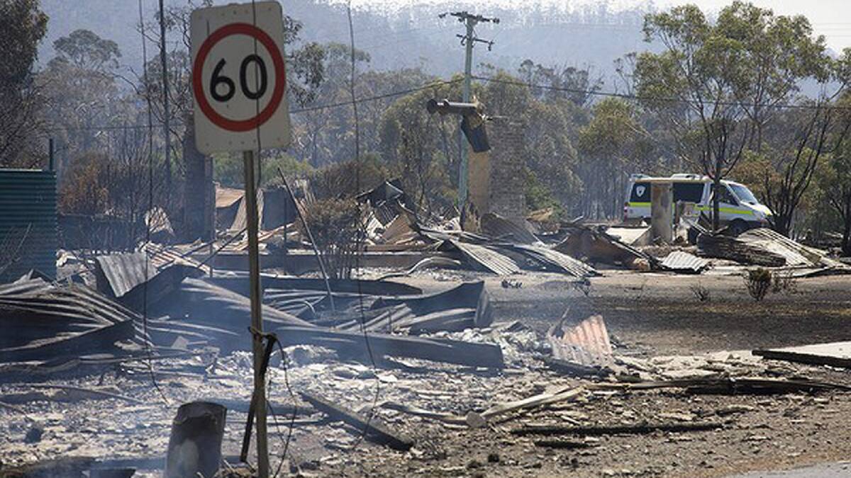 Burnt houses at Dunalley on the east coast of Tasmania after a bushfire ravaged the town. Photo: Peter Mathew