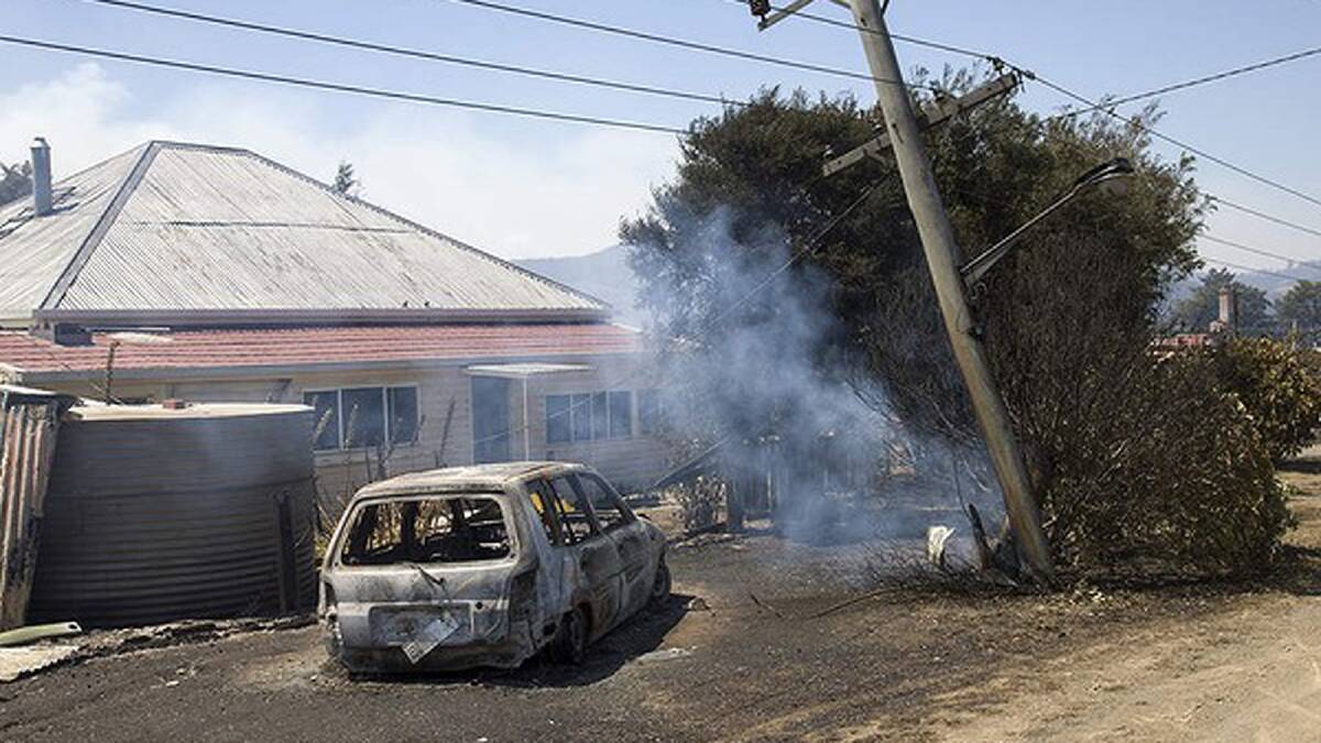 Burnt houses at Dunalley on the east coast of Tasmania after a bushfire ravaged the town. Photo: Peter Mathew