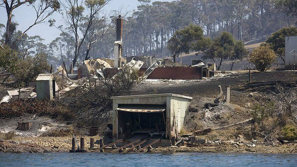 A burnt down house at Connellys Marsh a small shack community near Dunalley. Photo: Peter Mathew