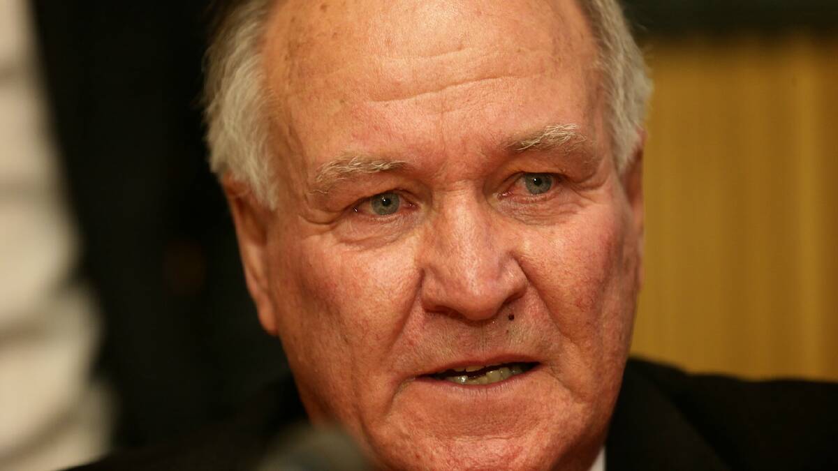 Tony Windsor appears visibily emotional as he announced his retirement from parliament in Canberra. 