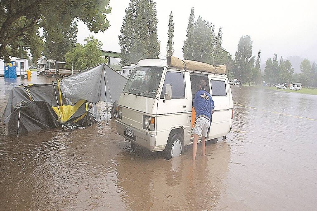 The Leader's photographers took these photos of residents and campers during the 2004 floods which happened at the annual Tamworth Country Music Festival.
