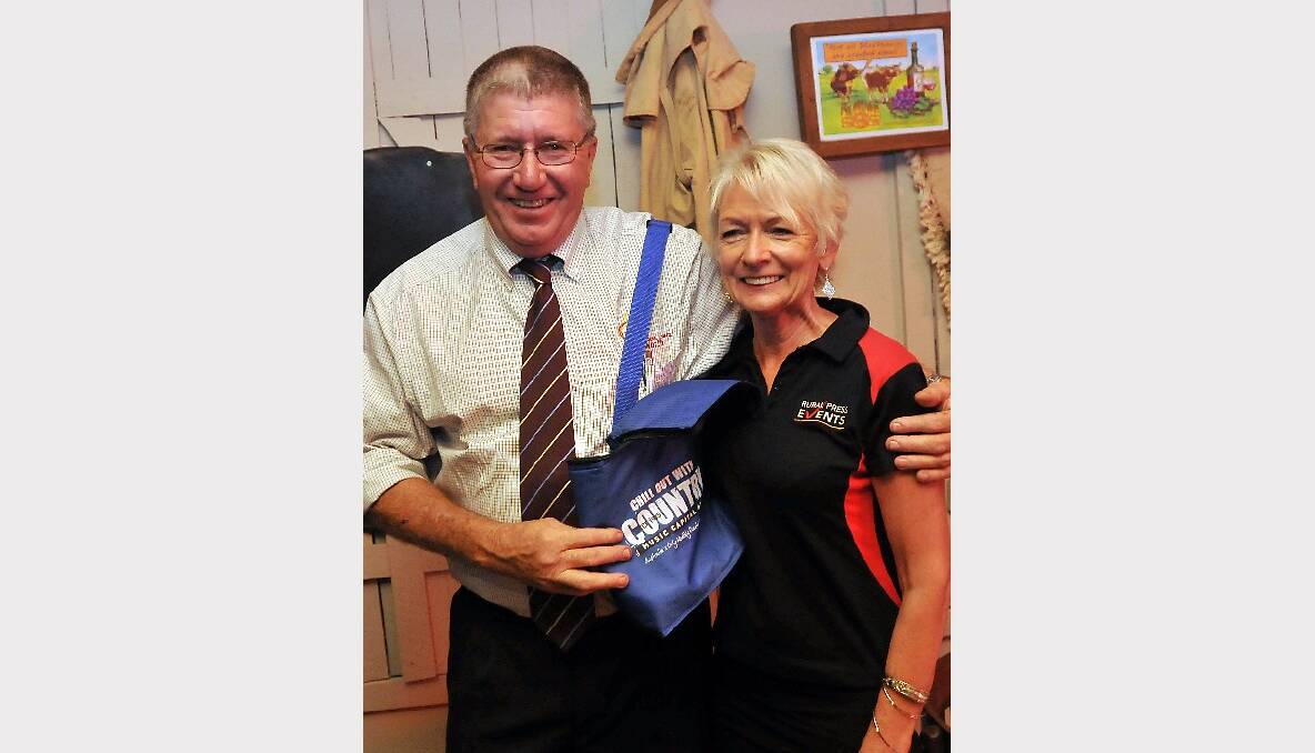 COUNTRY COOL: Di Lockwood presents Mayor Col Murray with a special festival chiller pack showbag at the Rural Press Events launch this week ahead of the festival.